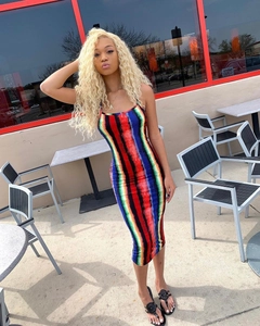 Detail view of colorful rainbow striped sleeveless midi dress with vertical gradient pattern