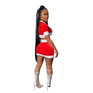 Detailed side view of Christmas velvet crop top and mini skirt set with white trim