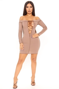 Detail of a brown off-shoulder ribbed mini dress with contrast stitching and front lacing