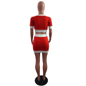 Detail view showing the back of a red two-piece slim fit crop top and mini skirt set