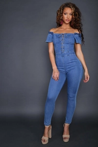 Close-up of the lace-up eyelet detail on the front of a blue off-shoulder denim jumpsuit