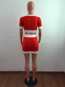 Detailed back view of red two-piece knit set featuring contrast white piping on a female torso
