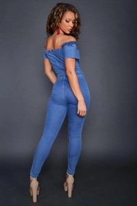 Detail of off-shoulder denim jumpsuit showing ruffled neckline and slim fit back design