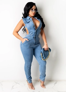 Detail of light blue denim jumpsuit featuring waist cut-outs and slim-fit sleeveless design