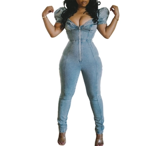 Slim fit light blue denim jumpsuit with puff sleeves and front metal zipper closure