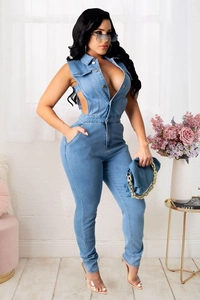 Detail showing side waist cut-out and metal buttons on light blue denim jumpsuit