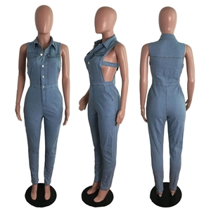 Detail of light blue denim sleeveless jumpsuit with side cut-outs and lapel collar