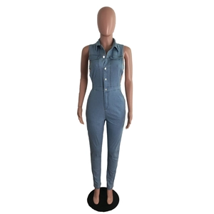 Detail view of light blue sleeveless denim jumpsuit featuring a button-up front and lapel collar
