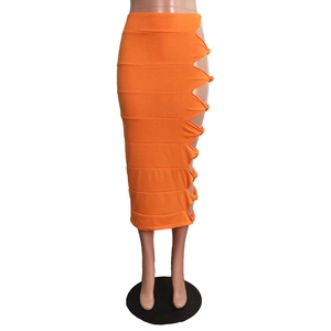 Detail view of the orange midi skirt featuring side hollow-out knotting and cutout design