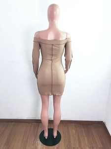 Detail of khaki ribbed knit texture and slim bodycon fit on a long sleeve dress