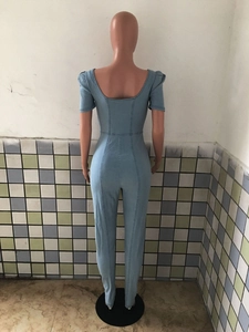 Rear view of slim fit light blue denim jumpsuit featuring fashion puff sleeves
