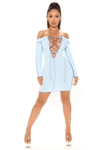 Close-up of light blue ribbed knit dress featuring a criss-cross lace-up neckline detail