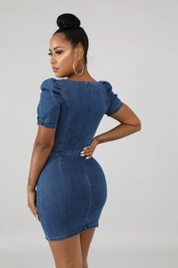 Detail of slim-fit dark blue denim dress featuring puff sleeves and back zipper