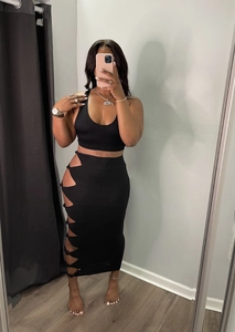 Detail view of the side cutout knotting and ribbed texture on this black two-piece skirt set