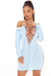 Detail of light blue ribbed knit dress featuring sexy cross-tie hollow-out front design