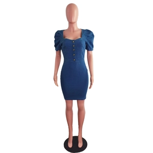 Detail of blue denim dress with gold buttons, puff sleeves and square neckline