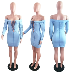 Detail of light blue bodycon dress with criss-cross lacing and contrast stitching seams
