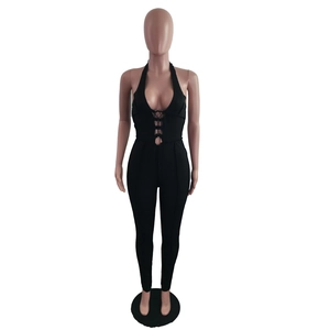 Detail of sexy black halter neck jumpsuit with crisscross lace-up hollow out design