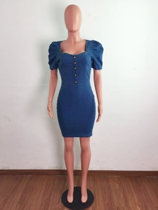 Detail of dark blue denim dress with puff sleeves and buttoned front square neckline