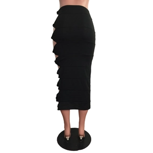 Detail view of the high waist side cut-out and gathered ruching on black midi skirt