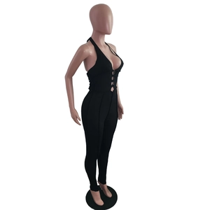 Side view of black ribbed halter jumpsuit featuring sexy front lace-up cutout detail