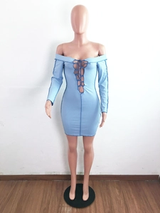 Detail view of light blue off-shoulder dress featuring lace-up front and ribbed knit fabric