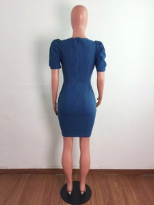 Detail view of the back seam and slim fit denim texture on this puff sleeve mini dress
