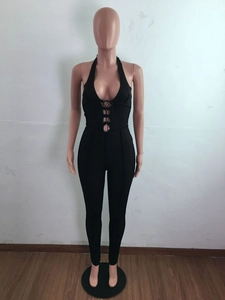 Macro detail of the halter neck cross strap design on this sexy black jumpsuit