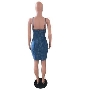 Detail view of the back metal zipper on a blue polka dot denim bodycon mini dress