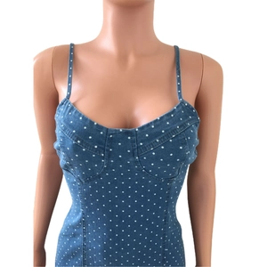 Detail of blue polka dot denim dress with spaghetti straps and sweetheart neckline