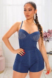 Close-up of slim fit denim romper with sparkling rhinestone fringes on the chest