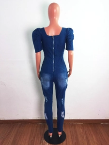 Detail view of denim jumpsuit back with square neck, long metal zipper and bubble sleeves