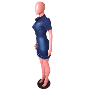 Detail shot of blue denim bodycon dress showing front button closure and raw frayed hemline