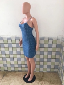 Detail of blue polka dot denim dress showing slim fit cut and thin shoulder straps