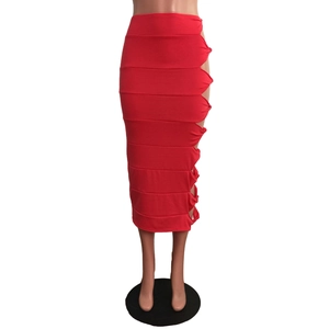 Detail view of red high waist bodycon skirt with side cutout knot and layered texture