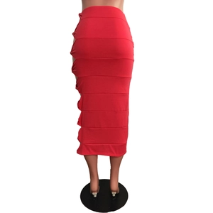 Macro shot of red bodycon midi skirt featuring horizontal seams and side cutout knots