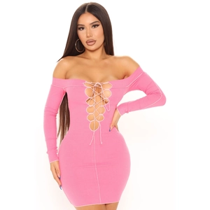 Detailed view of pink ribbed knit texture and lace-up neck design on bodycon dress