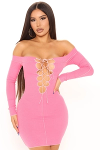 Detail of pink rib-knit dress showing off-shoulder neckline and lace-up chest design