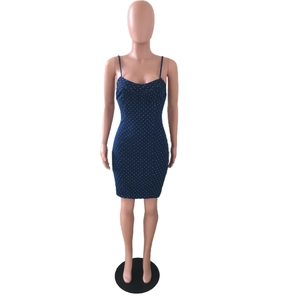 Detail of polka dot denim mini dress featuring slim spaghetti straps and sweetheart neckline