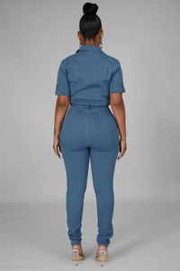 Rear view of a casual short-sleeved denim jumpsuit with tie-waist in medium blue wash