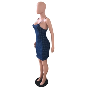Detailed side view of dark blue polka dot bodycon dress with slim straps and denim texture