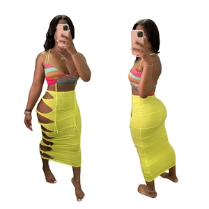 Women's two-piece set featuring rainbow halter top and neon yellow hollow out maxi skirt