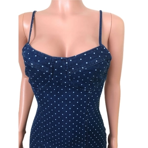 Close-up of dark blue polka dot denim bodycon dress with sweetheart neckline detail