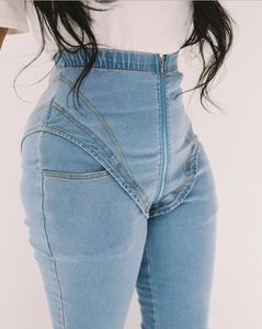 Detailed view of women's high-waisted stretch denim jeans with V-shaped seam