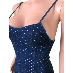 Detailed view of dark blue polka dot denim dress with slim fit and spaghetti straps