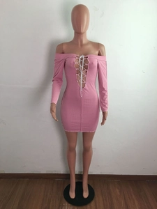 Detail of pink ribbed knit mini dress with lace-up front and off-shoulder design