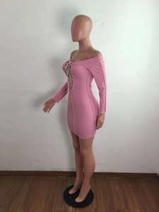 Side view of pink ribbed knit off-shoulder mini dress with drawstring cutout detail