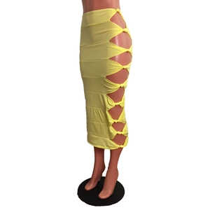 Close-up of bright yellow midi skirt featuring sexy side cut-outs and decorative knot details