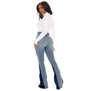 Women's high waist flared jeans with patchwork denim design and raw hem details