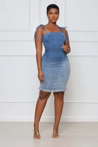 Close-up of the distressed raw hem and denim texture on this slim fit bodycon dress